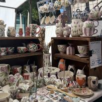 A pottery stall at a crafts market.