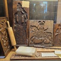 Wooden carvings of important members of society used to shape bread or moldable foods. 