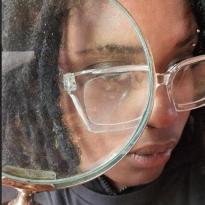 The author of this blog is holding a magnifying glass to their eyeball