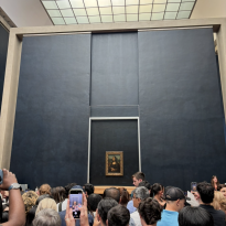 A faraway view of the famous Mona Lisa at the Louvre museum