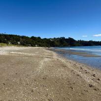 A shot of Onetangi beach taken from on the beach showing the expanse of the sand.
