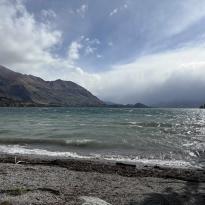 A beach view of the windy waves of Lake Wānaka.
