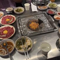 Table spread of a korean barbecue dinner.