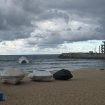 Beach with cloudy skies above
