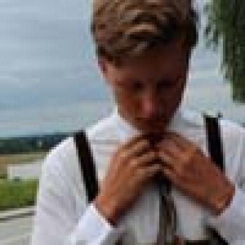 Five smiling people in individual close-up photos. This alt text was added with Al; accuracy may vary.