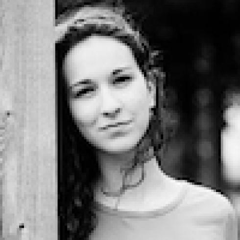 Smiling woman with straight hair; woman with curly hair; serious man in plaid shirt; woman by wooden post. This alt text was added with Al; accuracy may vary.