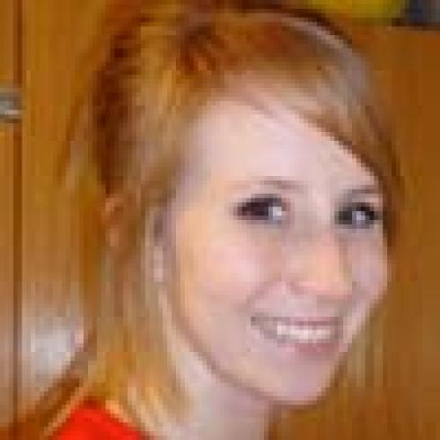 Four smiling women in close-up portraits with various hairstyles. This alt text was added with Al; accuracy may vary.