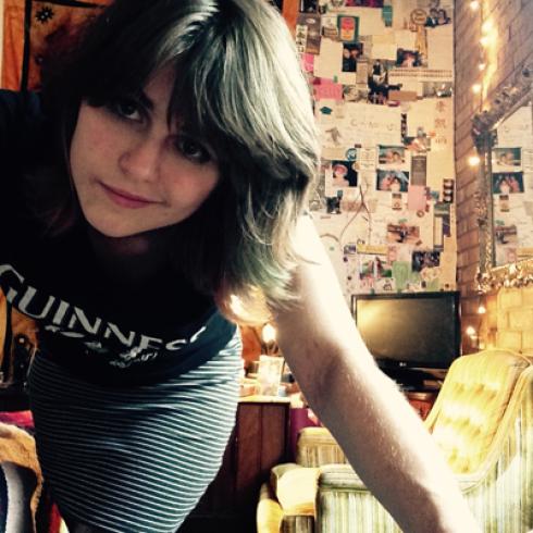 1. Smiling woman at a scenic overlook during sunset.
2. Woman with a friendly smile, medium-length blond hair.
3. Tall spire overlooking a city at dusk, sky in purple hues.
4. Woman in T-shirt leaning forward in a cozy room. This alt text was added with Al; accuracy may vary.