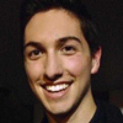 Smiling woman in white shirt; smiling man in dark shirt. This alt text was added with Al; accuracy may vary.