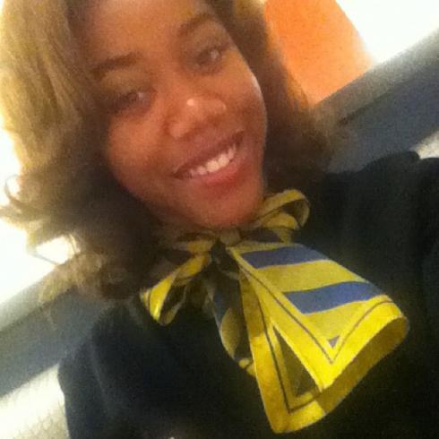 Five smiling individuals in various settings. This alt text was added with Al; accuracy may vary.