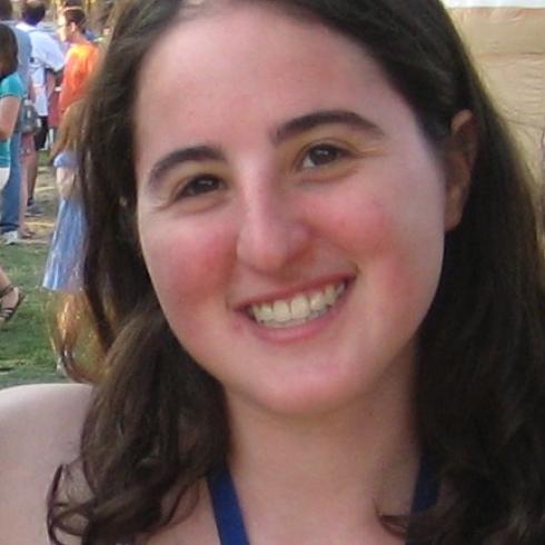 1. Smiling woman in a restaurant, wearing a light gray sweater.
2. Woman petting a resting tiger at a zoo, smiling at the camera.
3. Smiling woman with a lanyard, outdoors at a fair. This alt text was added with Al; accuracy may vary.