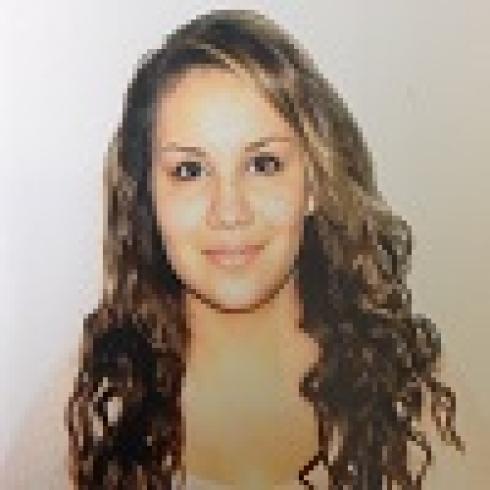 A person with glasses, short hair, and a beard in a bright room. This alt text was added with Al; accuracy may vary.