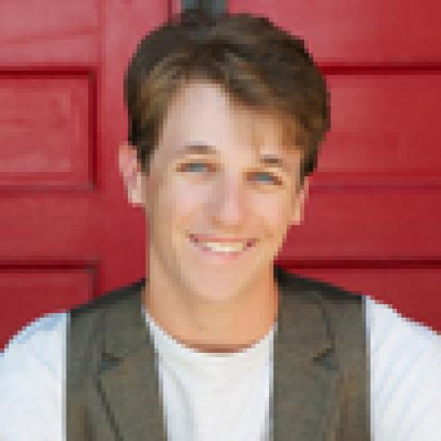 Cartoon character in skeleton costume with person outdoors. This alt text was added with Al; accuracy may vary.