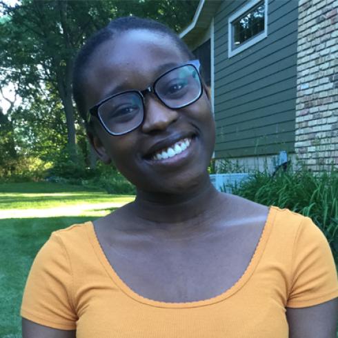  Woman with glasses smiling outdoors