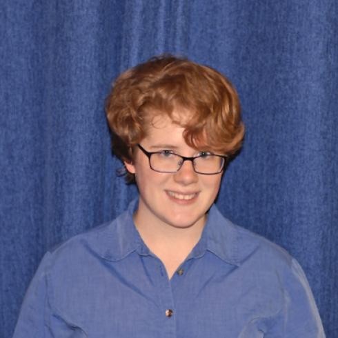 Young man with sunglasses in front of the Taj Mahal. This alt text was added with Al; accuracy may vary.