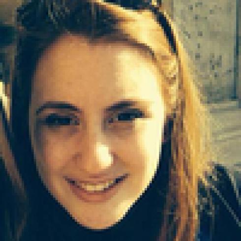 Elegant dining room with ornate blue walls and a lavishly set table. This alt text was added with Al; accuracy may vary.