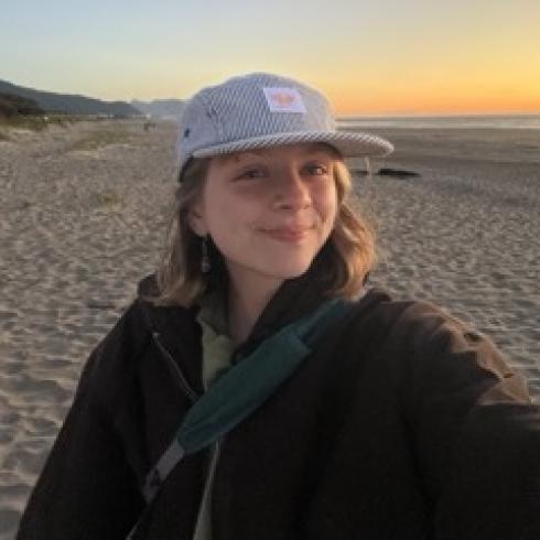 Frances smiles in a selfie on the beach