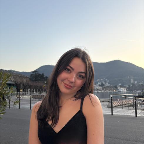 Charlotte Wilkerson smiling in front of nature.