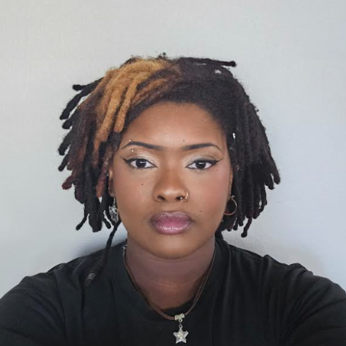Maxwell Harris-Gaspaire posing in front a white background.
