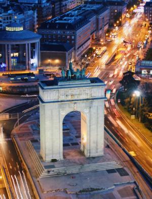 an aerial view of Arco de la Victoria in Madrid at night