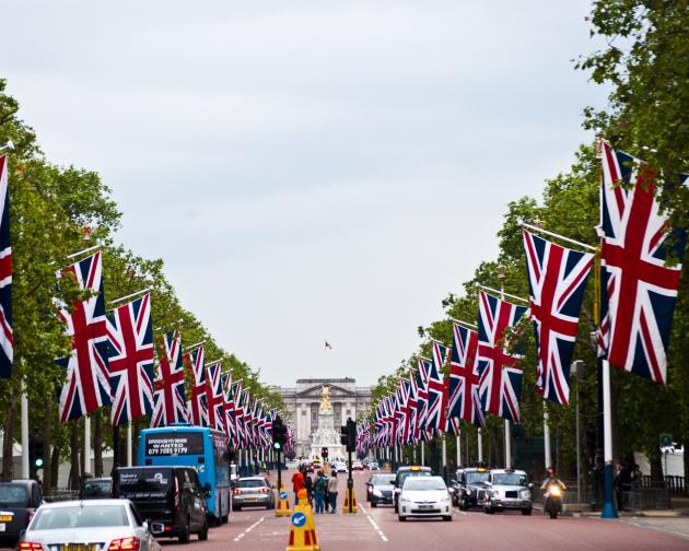 a British flag-lined street leading up to the Victoria Memorial