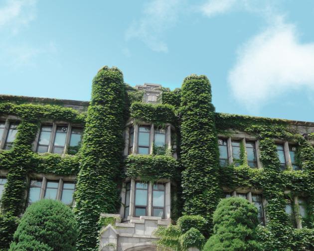 A stone building covered in lush greenery sits on the Yonsei University campus.