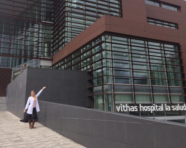 a Granada student intern standing outside of a hospital for her internship placement