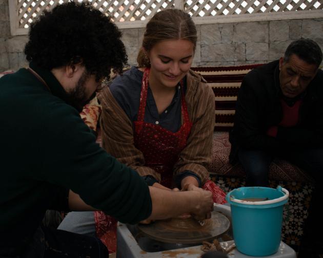 Students in Meknes making pottery.