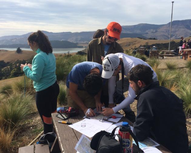 a group of students working on a project in nature