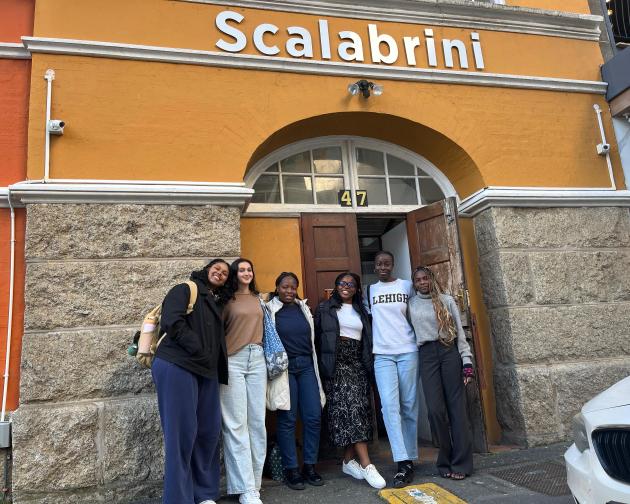 Group of people standing in front of a building