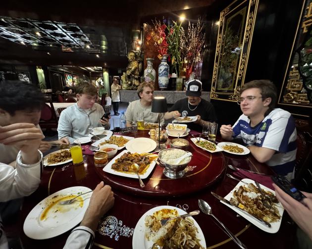 People sitting around a table eating