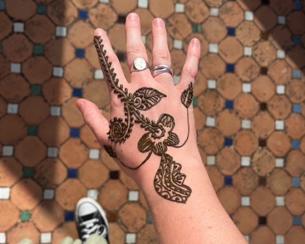 My hand with a henna pattern on it
