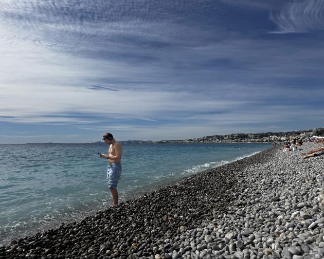 Man standing on a beach in Nice