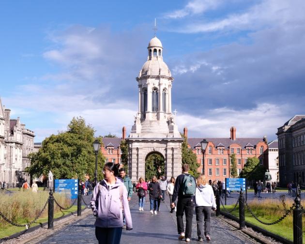 Students walking through Trinity College campus in Dublin
