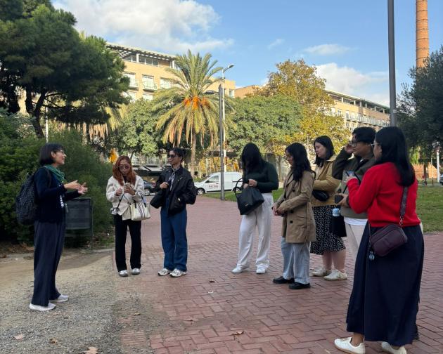 FEU students listening to faculty on a walking tour