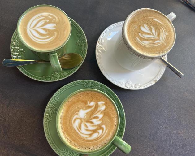 Three cups of coffee with latte art