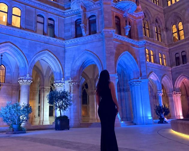 Standing in the Wiener Rathaus with colorful lighting