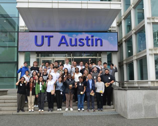 UT Austin students on customized program in Seoul in front of Digital UT Austin sign