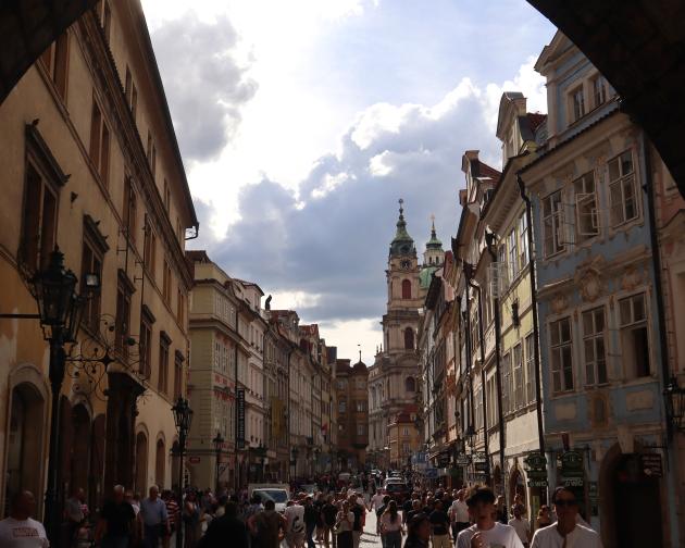 Buildings lining street through tunnel