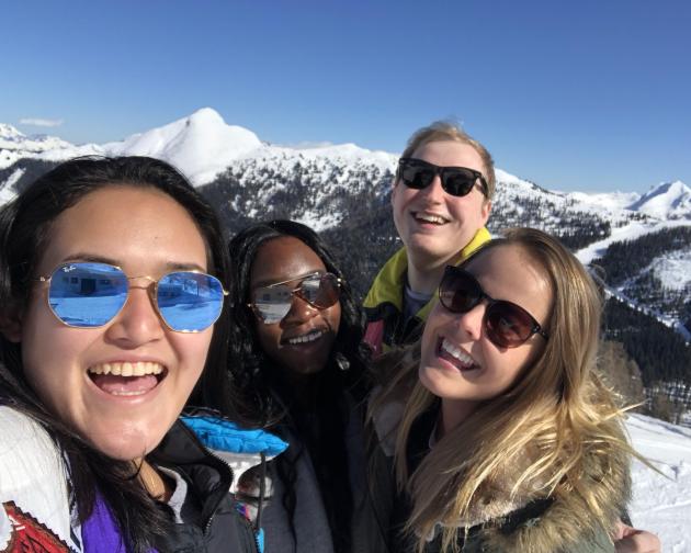 Four students in a snowy mountain region