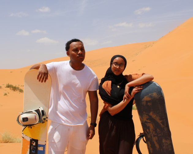 Students Exploring the desert and sandborading.