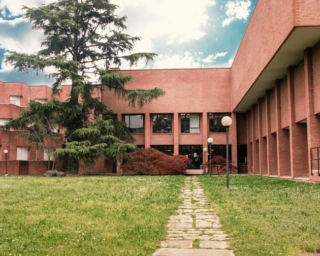 The exterior of a multi-level brick building.