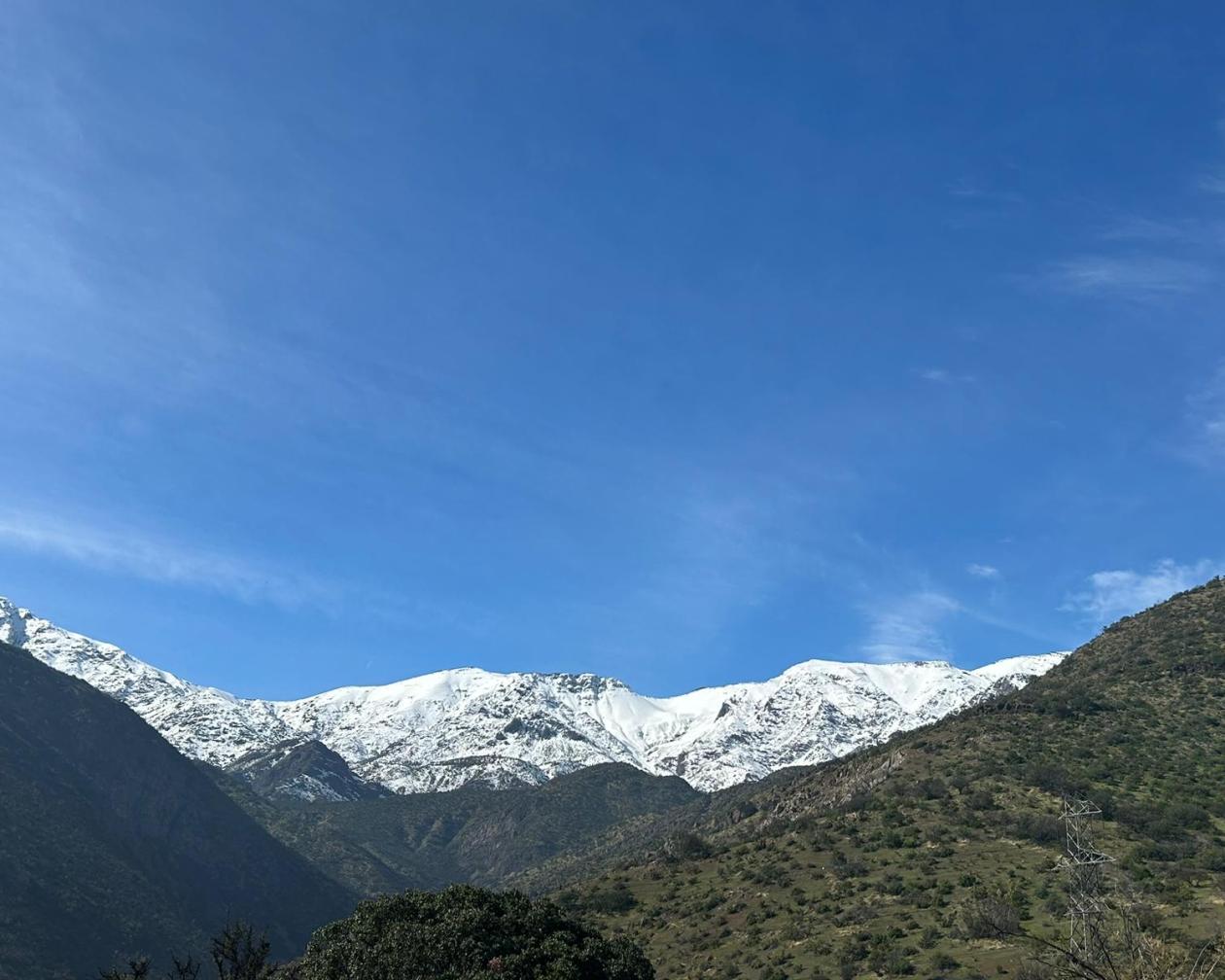 Snow-capped mountains under a blue sky