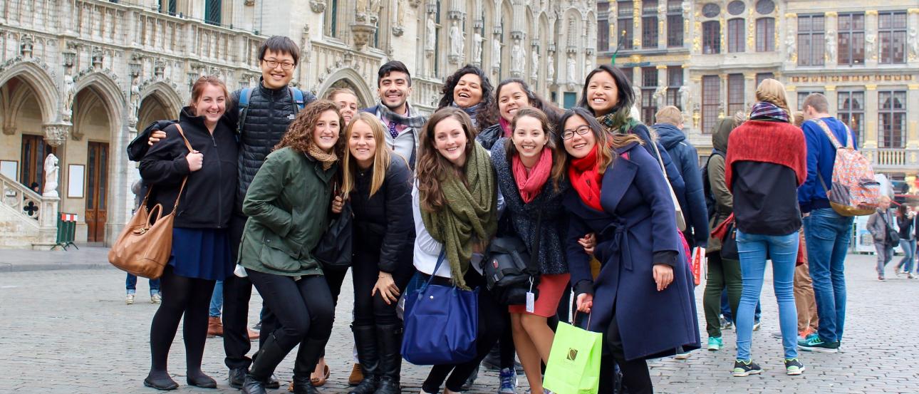 a group of students pose for a photo in Brussels City Center while on a field trip during the European Union program