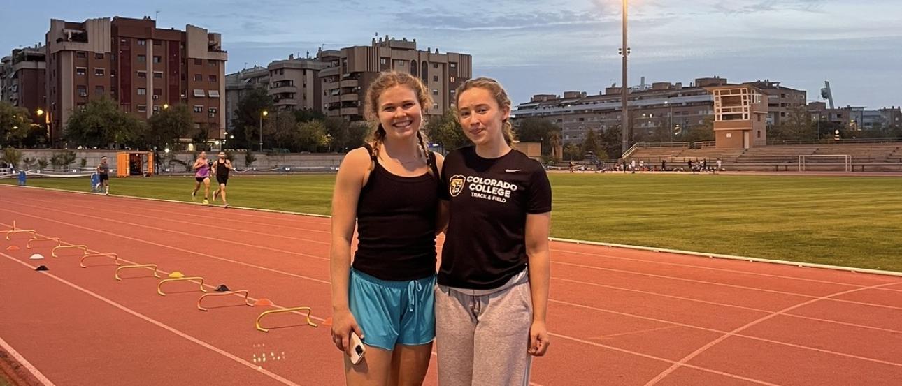 My friend Kensi and I at the track after running wickets, smiling for the camera at sunset
