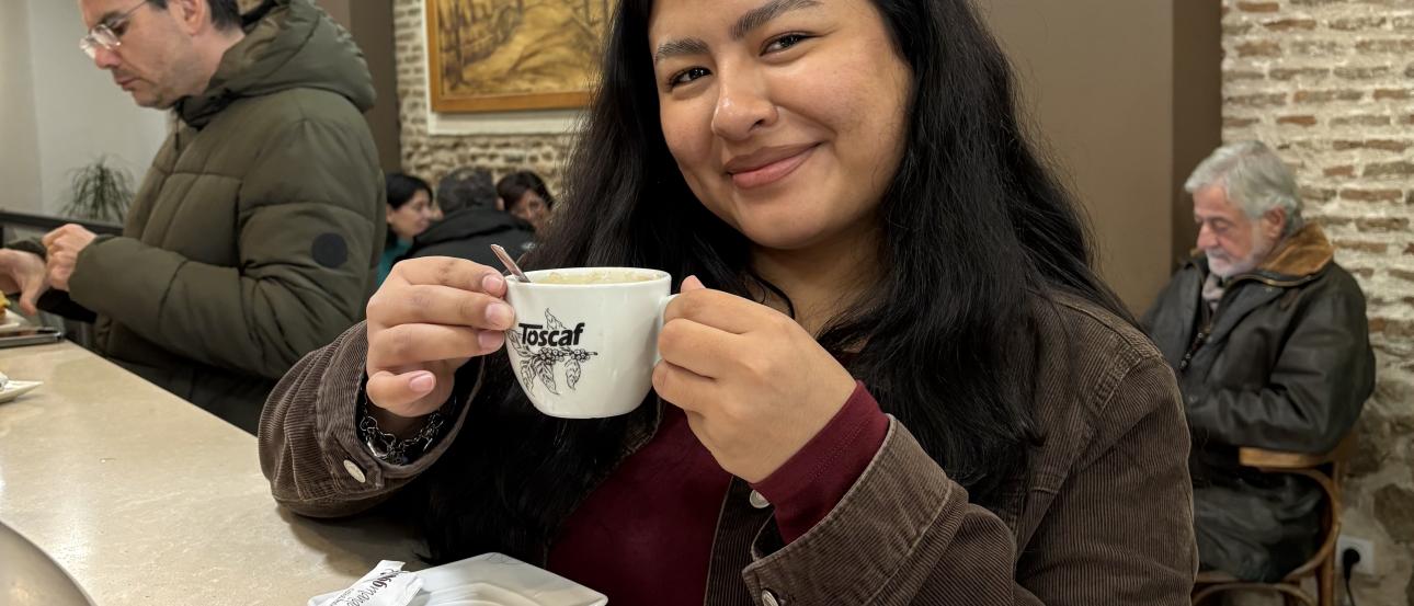 Person holding coffee 