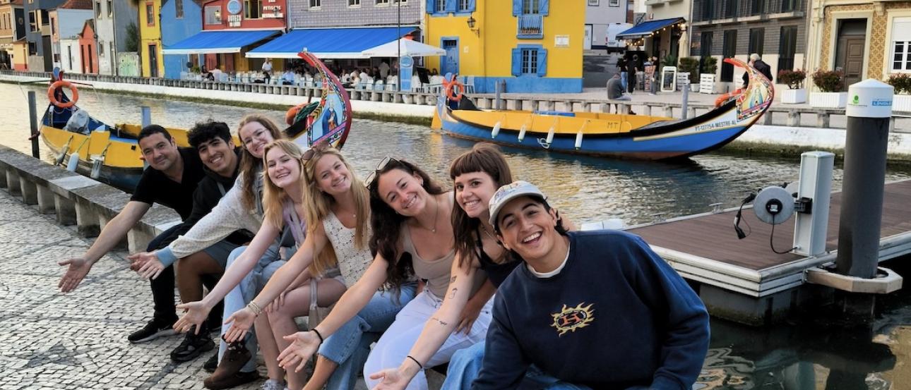 Students smiling on canal