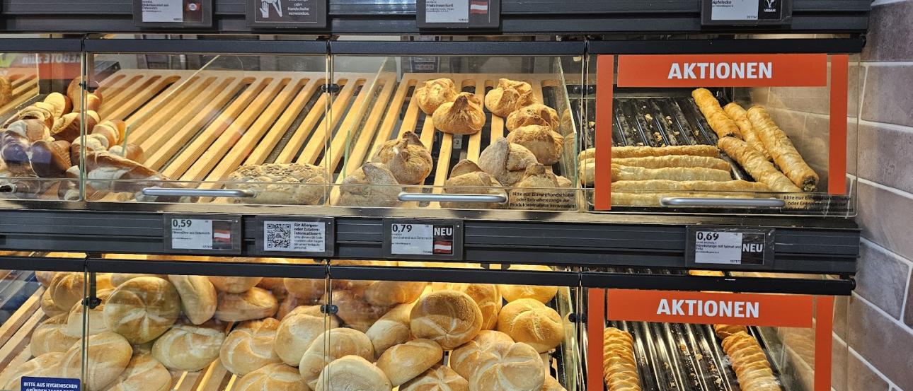 An image of Hofer's Bakery section, with various breads and sales.