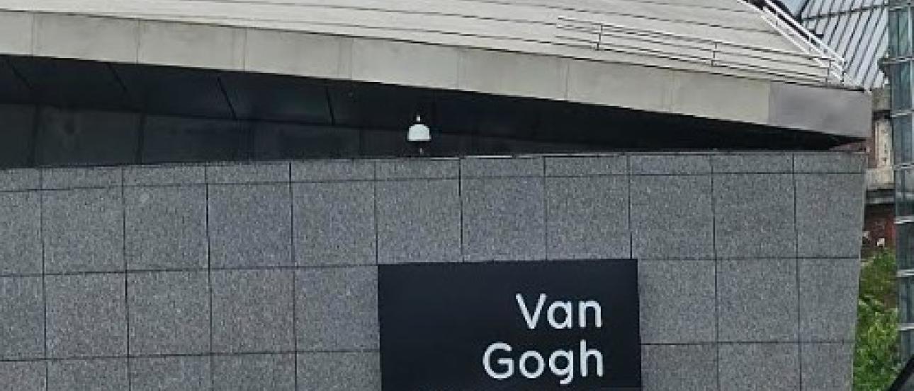 This is a far away snapshot of the sign labeled "Van Gogh Museum Amsterdam"