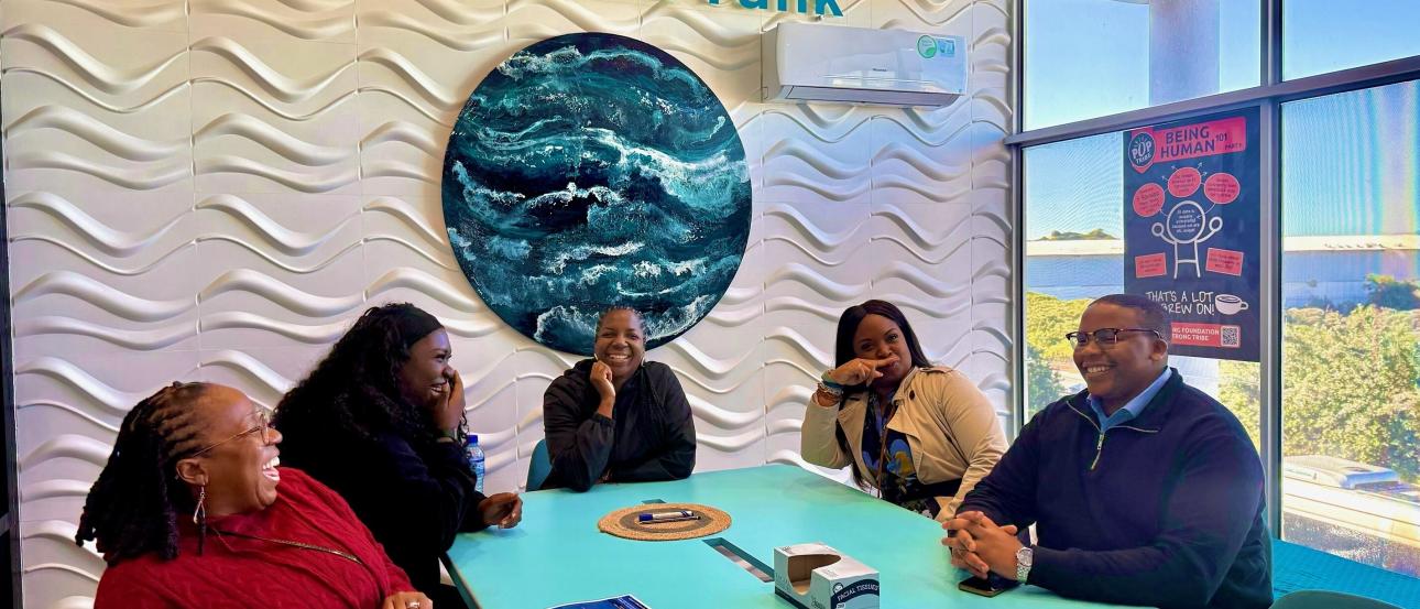 Faculty at a conference room table in Cape Town